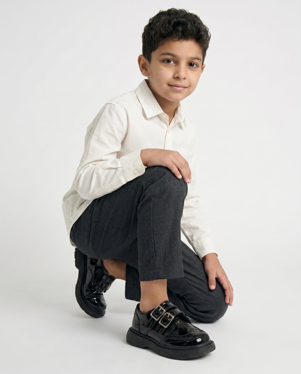 Boys glossy black patent monk shoe — three-quarter angle
