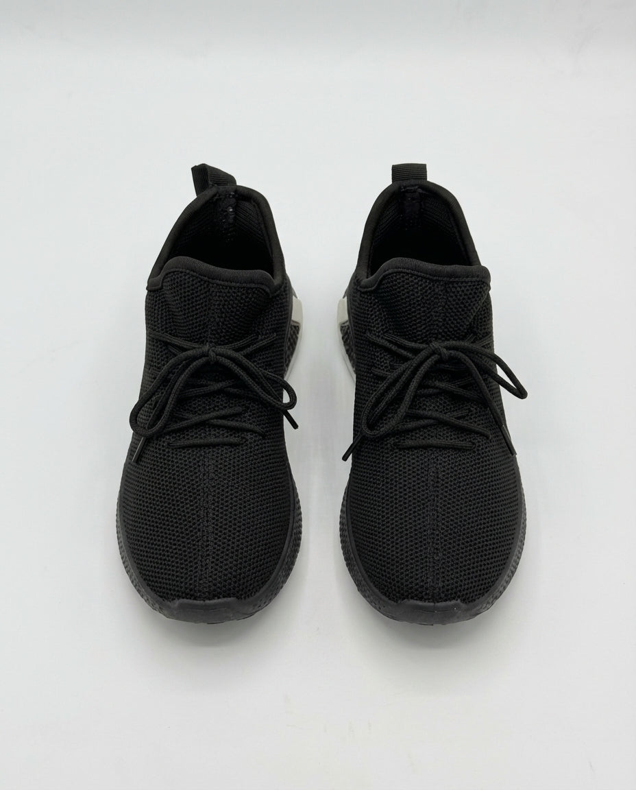 Boys little black knit mesh trainer — sole view