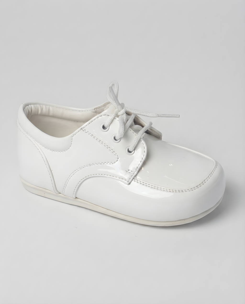 Boys classic white leather oxford shoe — three-quarter angle