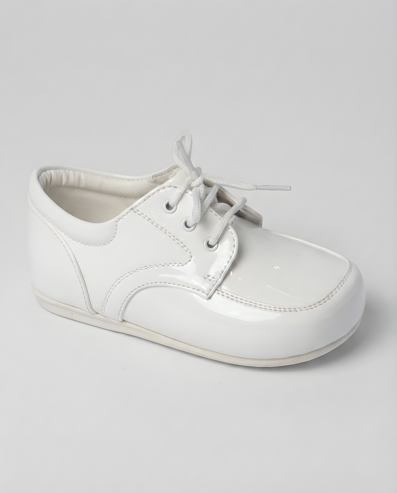 Boys classic white leather oxford shoe — three-quarter angle