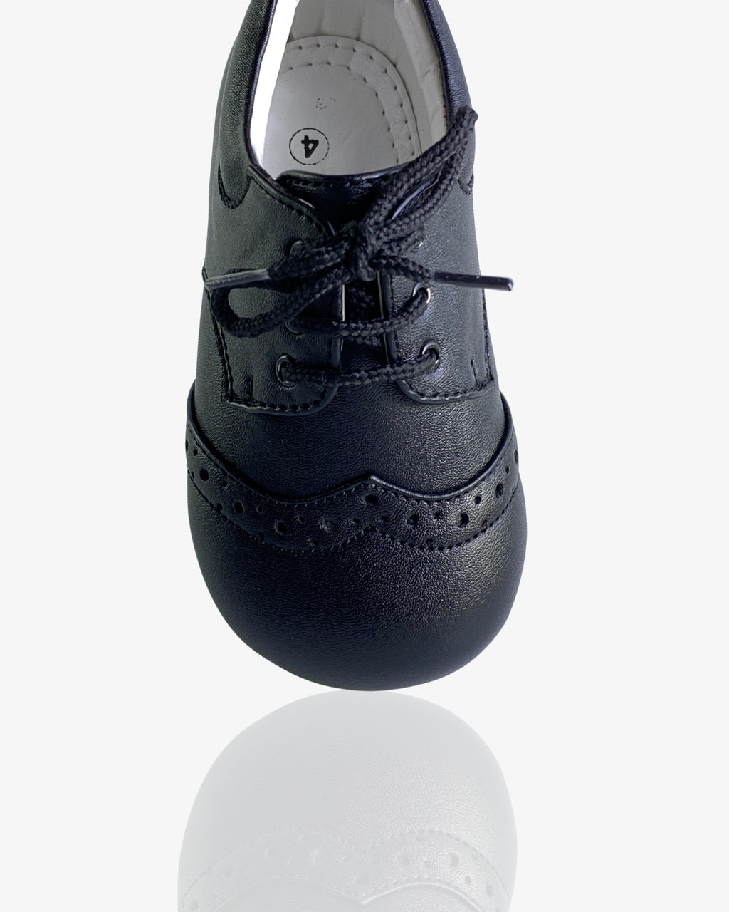 Boys classic black leather brogue shoe — sole view