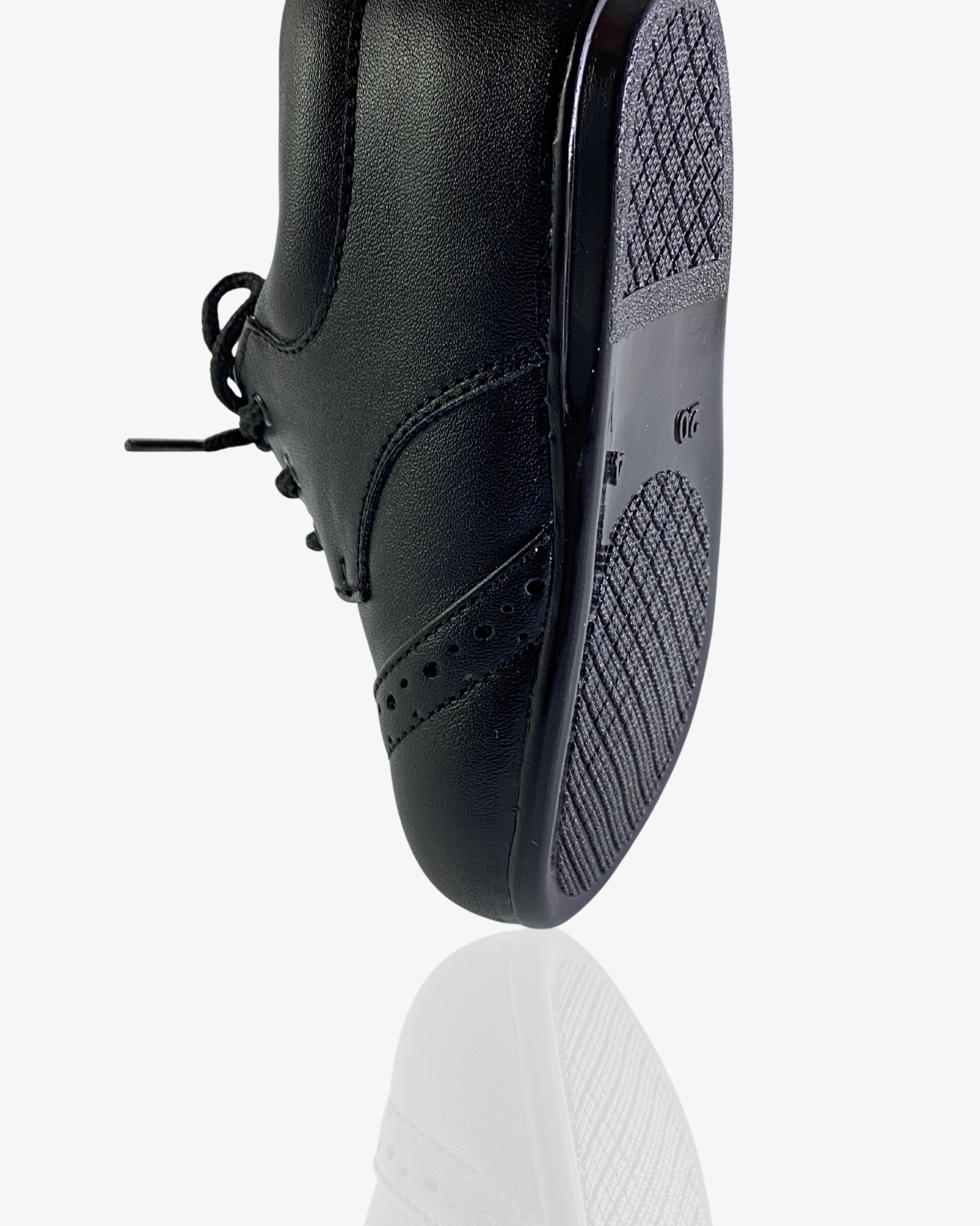 Boys classic black leather brogue shoe — three-quarter angle
