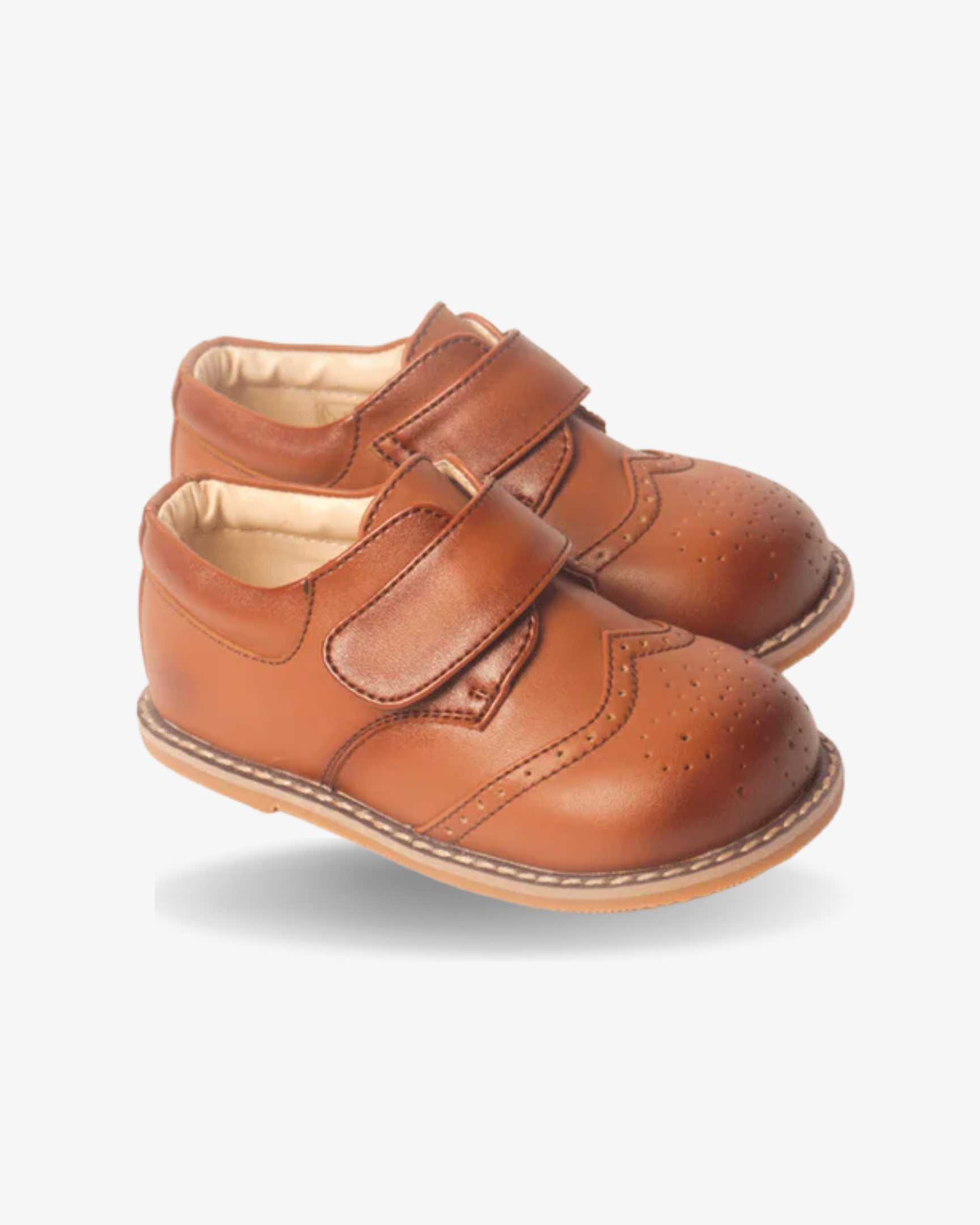 Boys cognac leather wingtip shoe — sole view